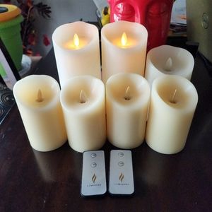 Luminara Flameless Pillar Candles. Set of 7 with 2 remotes.
